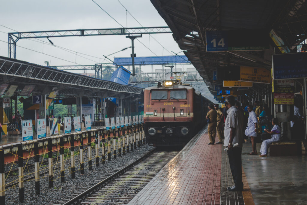 people watching as train approaches