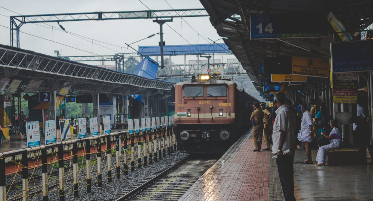 people watching as train approaches