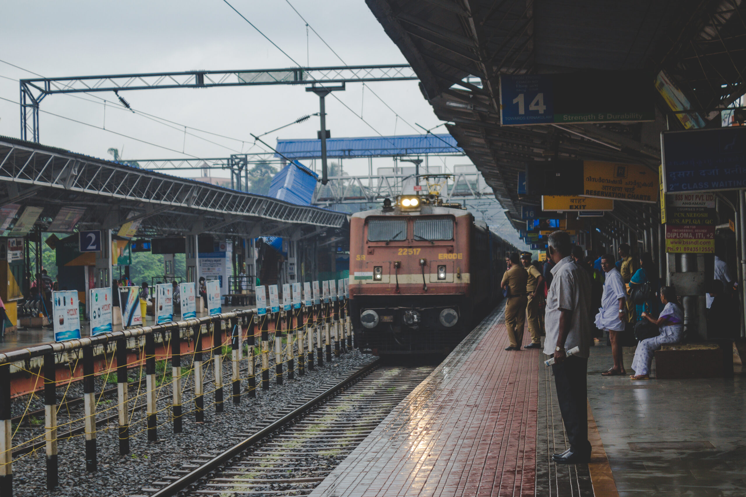 people watching as train approaches scaled